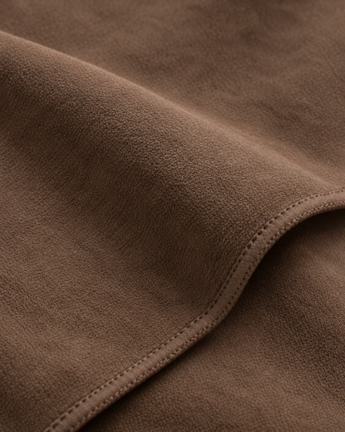 Cocoa suede-finish microfibre with a fine matte nap, a fluid fold and a narrow sewn edge